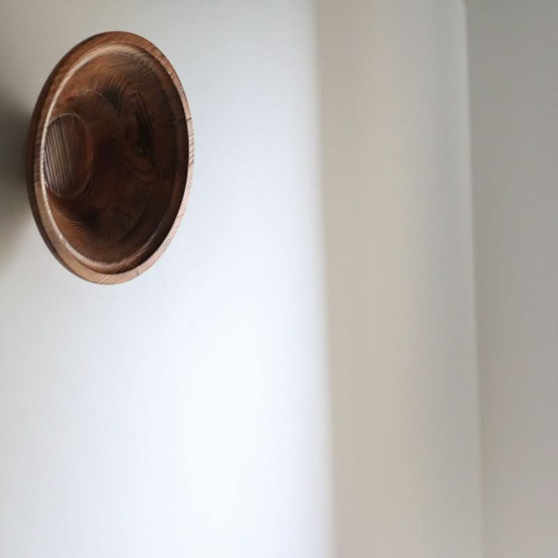 Handmade Retro Bowl: Rustic wooden bowl on a white wall, showcasing natural wood grain and home decor charm.