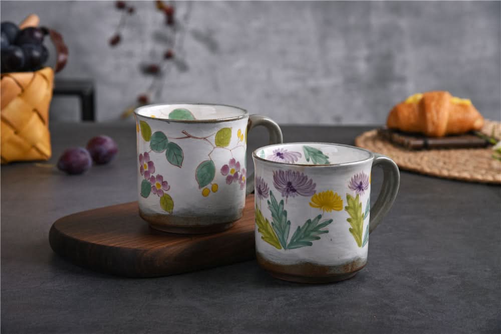 Two Japanese Underglaze Ceramic Flower Mugs, hand-painted with purple, yellow flowers & green leaves.