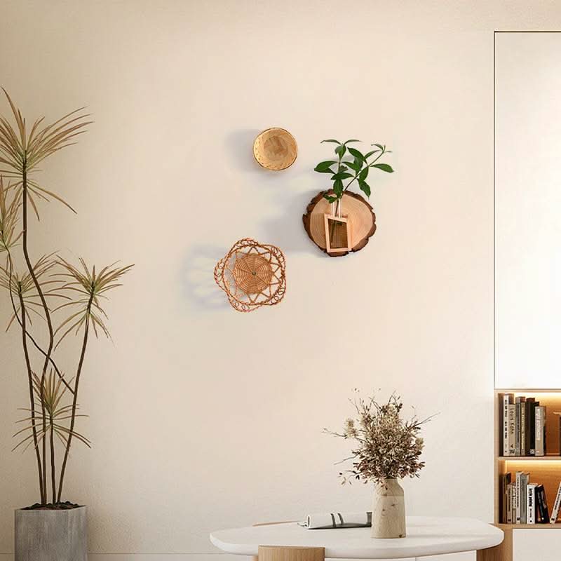 Wall Plant Hanger Tree Ring with wood slice, greenery, and woven decor on a neutral wall.