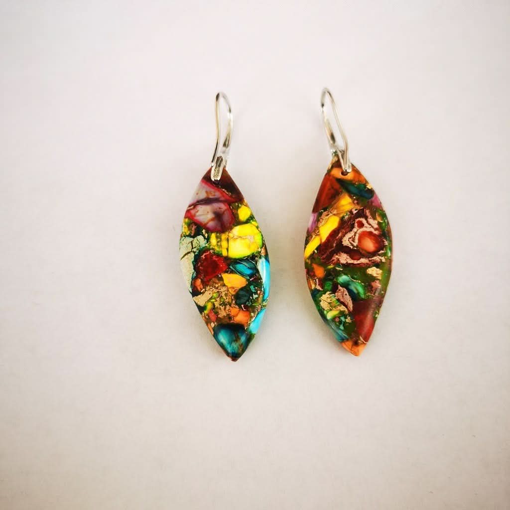 Colorful natural stone earrings with silver hooks, showcasing vibrant blues, reds, yellows, and greens.