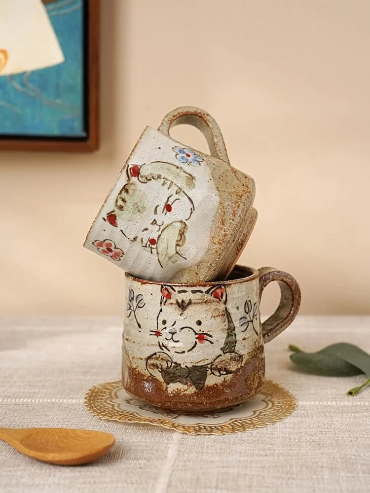 Hand Painted Coffee Mug 11oz with charming cat art and floral details, rustic ceramic finish.