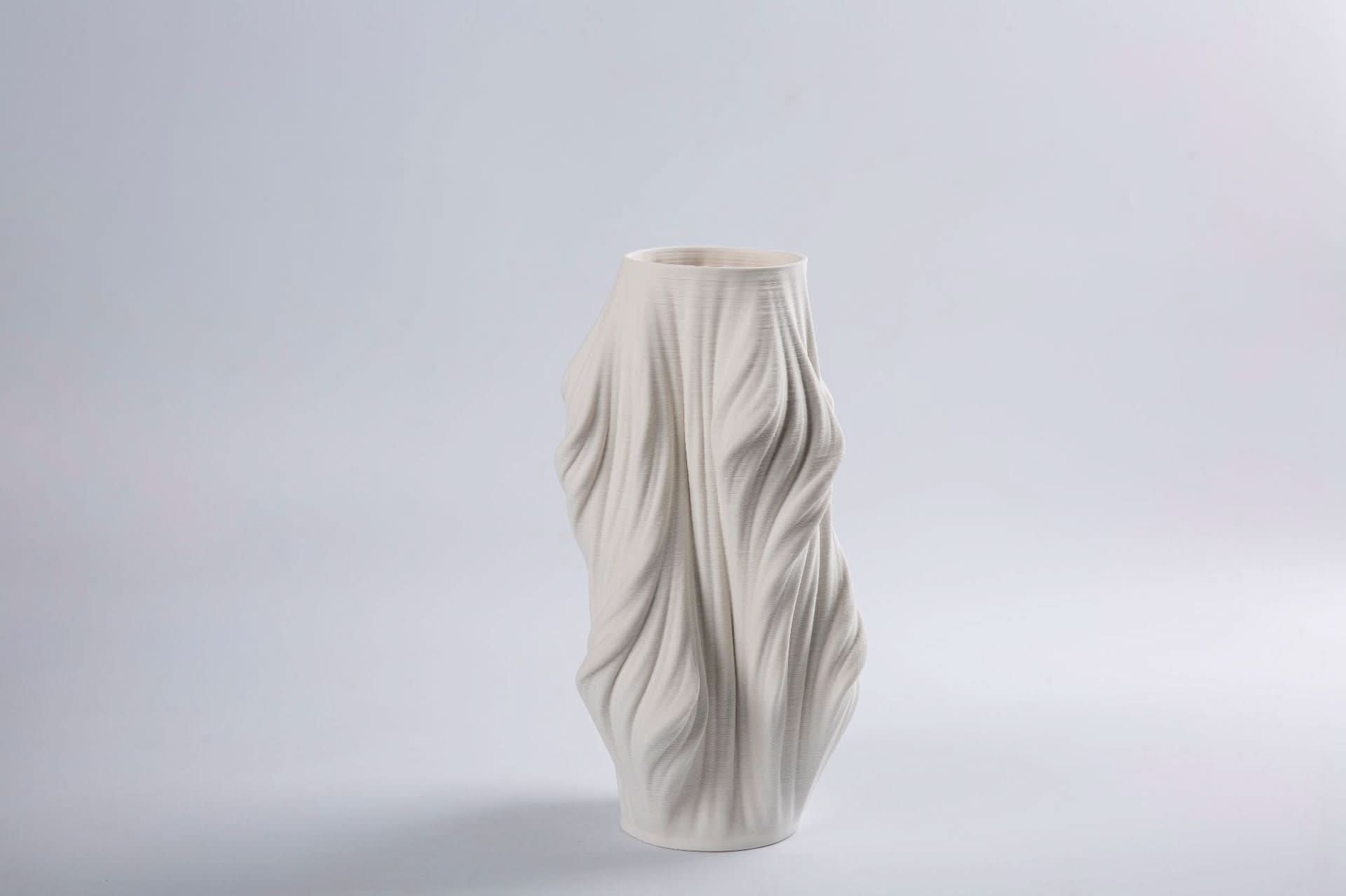 3D Printed Ceramic Vase in off-white with flowing texture, home decor accent.