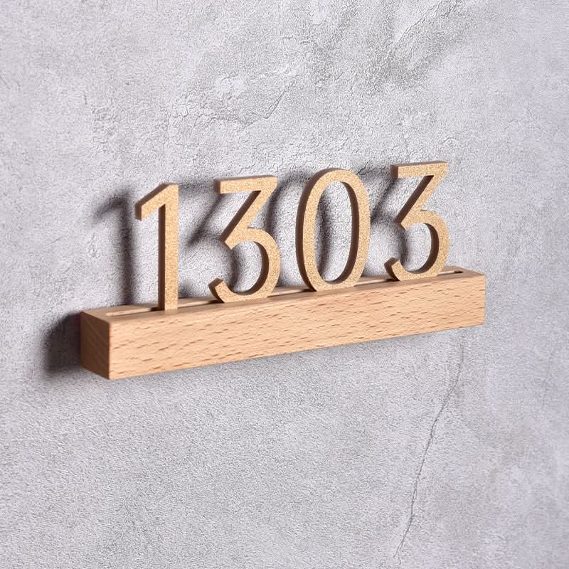 Solid Wood Custom Door Plate with numbers "1303" on a beech wood base, grey textured background.