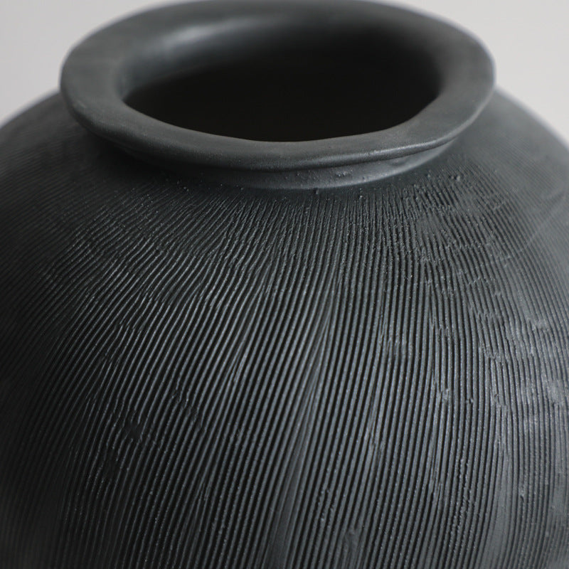 Black textured ceramic vase.