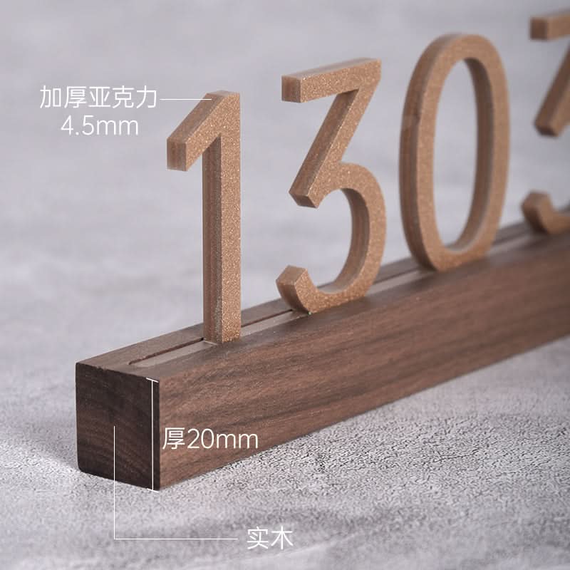 Solid wood custom door plate with walnut beech finish, featuring raised bronze-colored numbers.