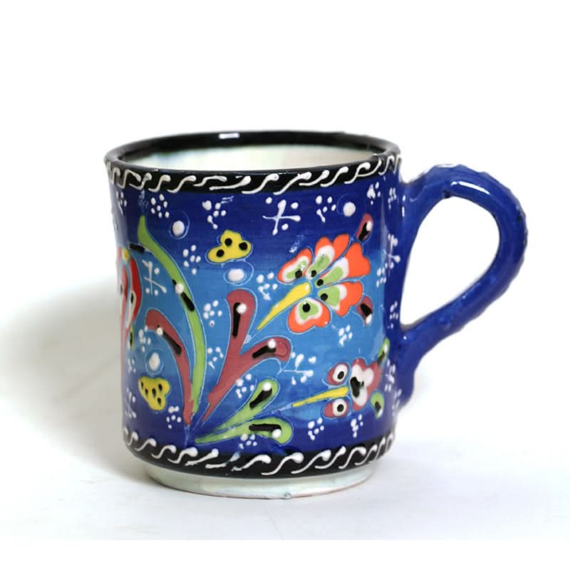 Blue Turkish glazed ceramic mug with vibrant floral designs. Home Decor.