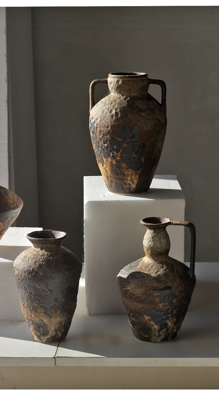 Rustic ceramic vases with textured brown and black glaze, home decor.