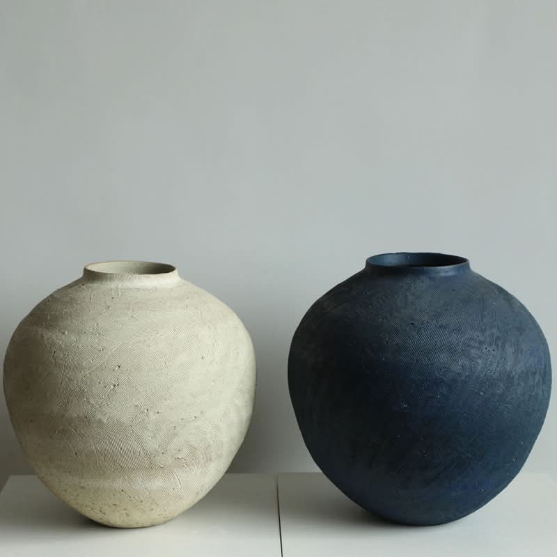 Round Textured Wabi-Sabi Vase in cream and navy with organic surface detailing.