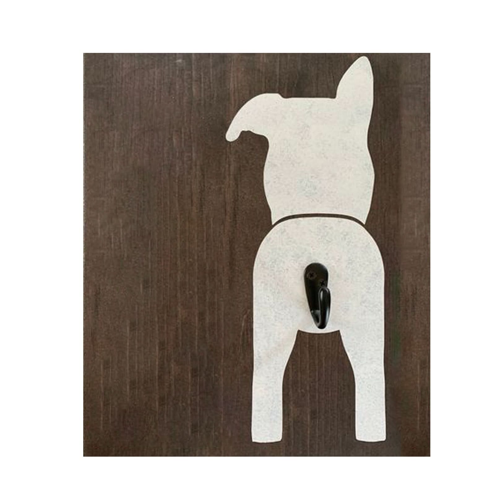 Wooden dog leash holder with black hook on dark wood. Farmhouse entryway decor.