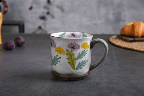 Japanese Underglaze Ceramic Flower Mug: hand-painted floral ceramic mug with purple & yellow blooms.