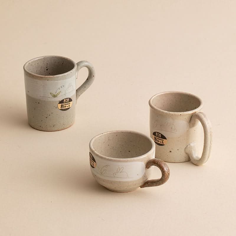 Stoneware Wangu Burning Rabbit Mug Made In Japan, cream & gray ceramic, subtle rabbit design, home decor.