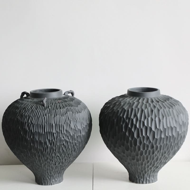 Two Wabi-Sabi Carved Irregular Black Ceramic Vases with textured surfaces against a white background.