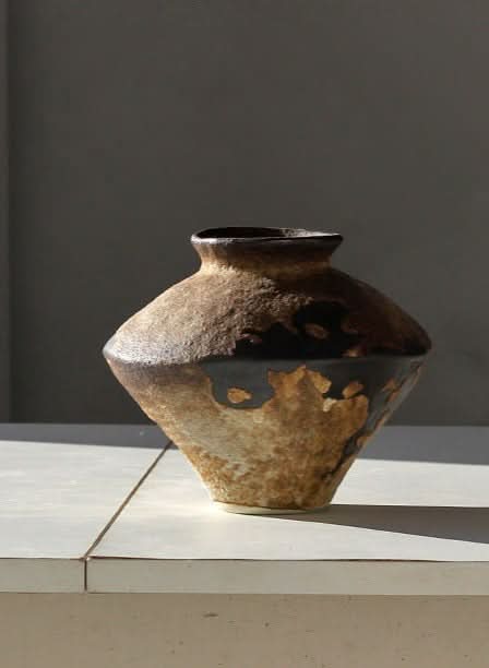 Textured brown and black ceramic vase, home decor.