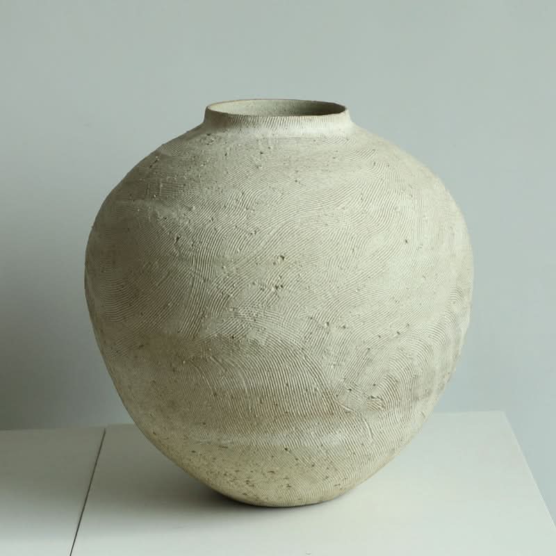 Round Textured Wabi-Sabi Vase in neutral ceramic with organic patterns.