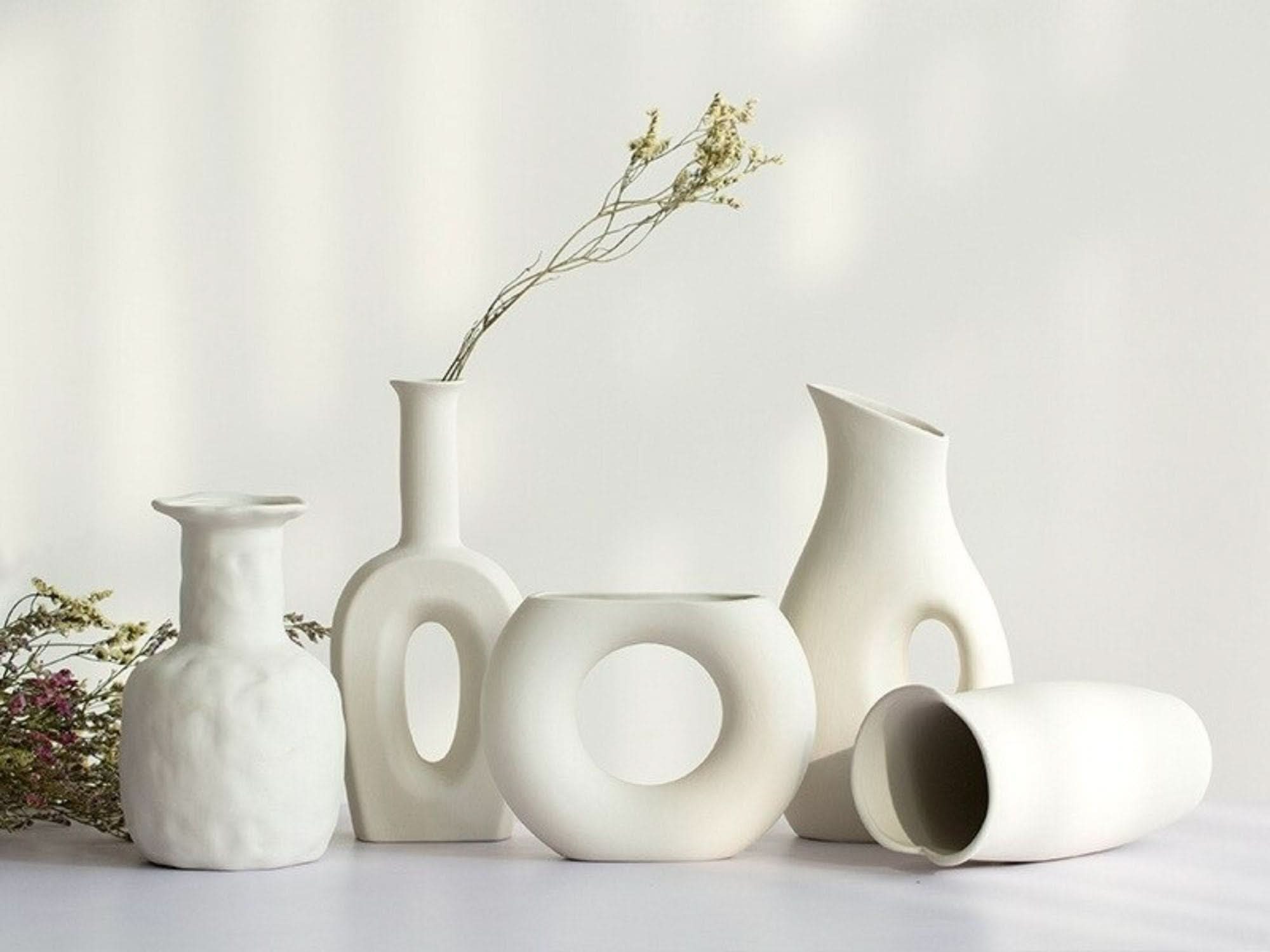 Abstract white vases, decorative, minimalist, and modern. Home decor.