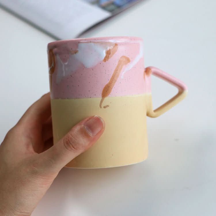 Artistic Triangle Handle Stoneware Mug: pink & yellow speckled glaze, modern home decor.