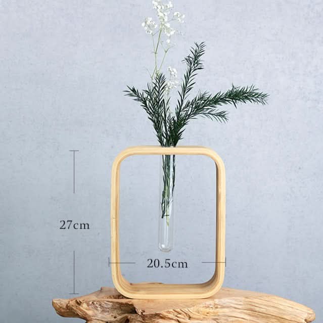 Modern wooden wall flower vase with glass test tube vase and greenery decor.