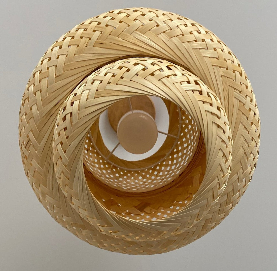 Handwoven bamboo pendant light, light beige color, intricate design.