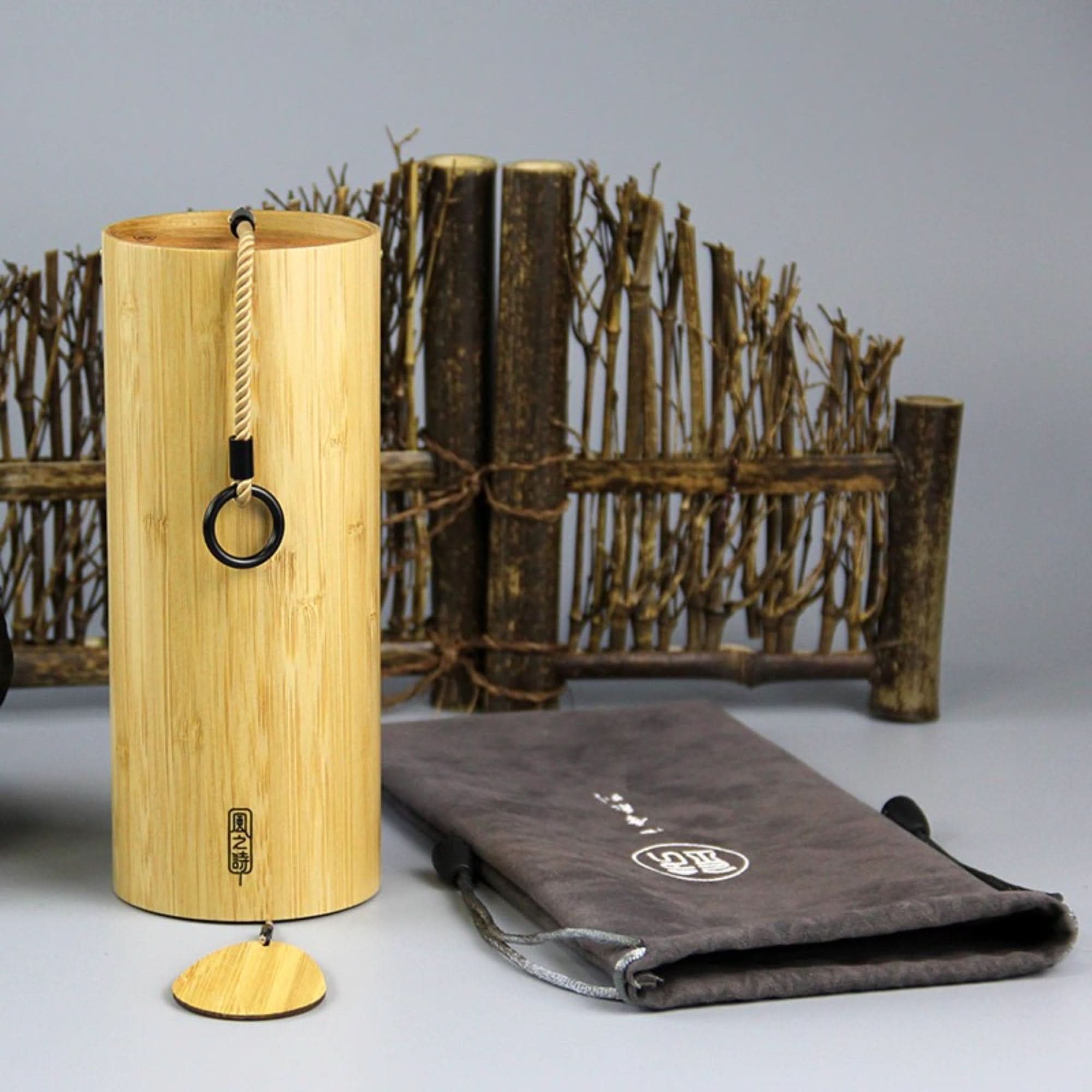 Natural bamboo wind chime 4 different melodies, with rustic wooden accent and grey pouch.