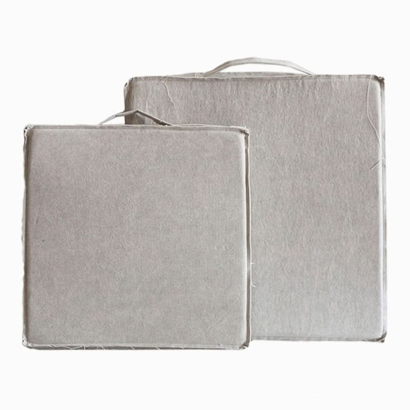 Two grey linen cushions, one square, one rectangular, with handles. Customizable Distressed Squared Linen Cushion.