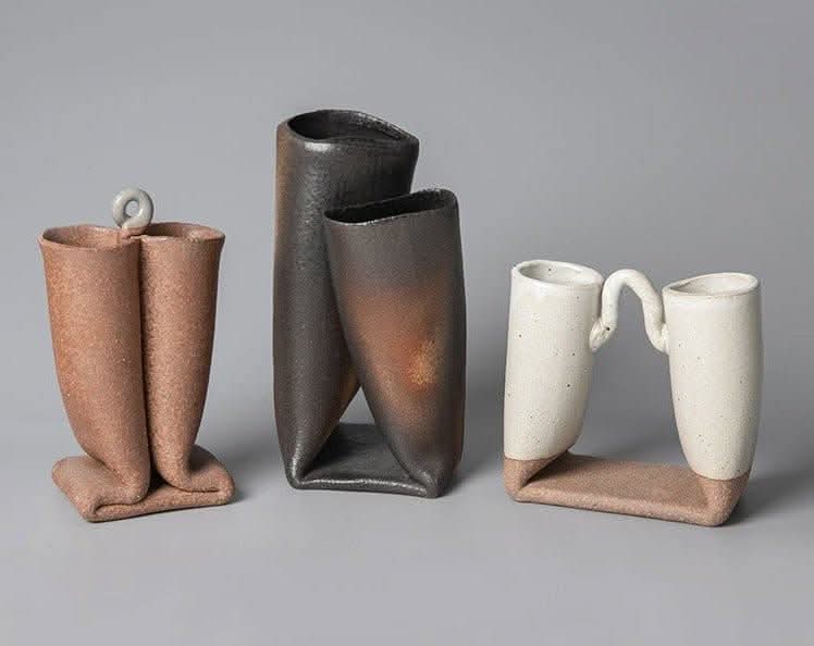 Bent tube textured rough pottery ceramic vase imported from Japan. Three unique Japanese ceramic vases.