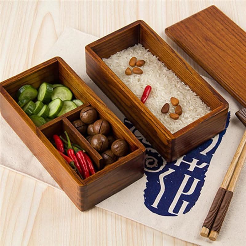 Wooden bento box with compartments filled with various food items.