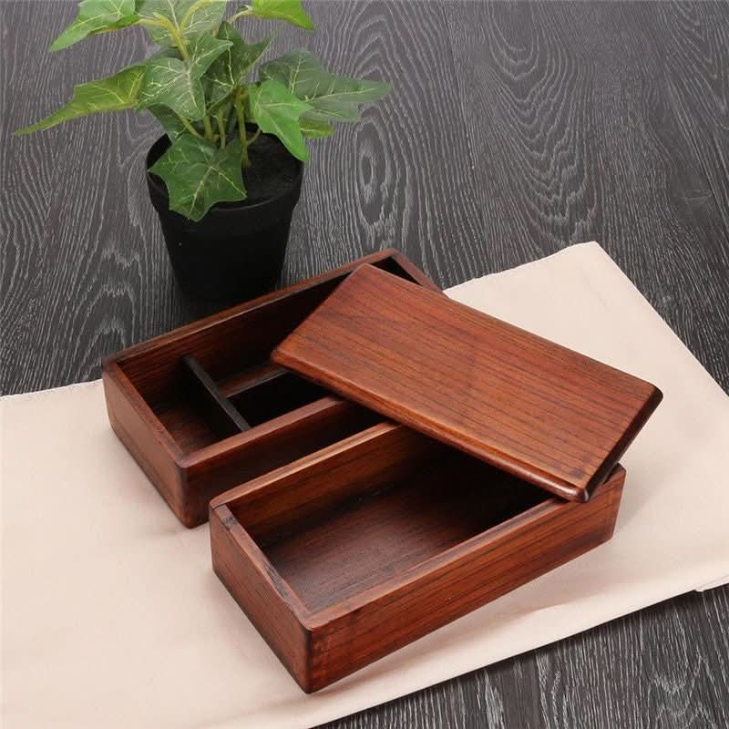 Wooden bento box, dark brown, divided compartments.
