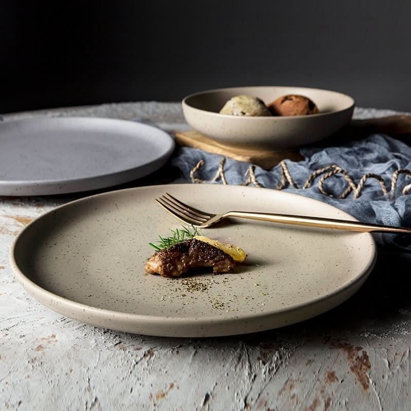 Nordic Plate: Bistro ceramic tableware in grey, for all-season dining.