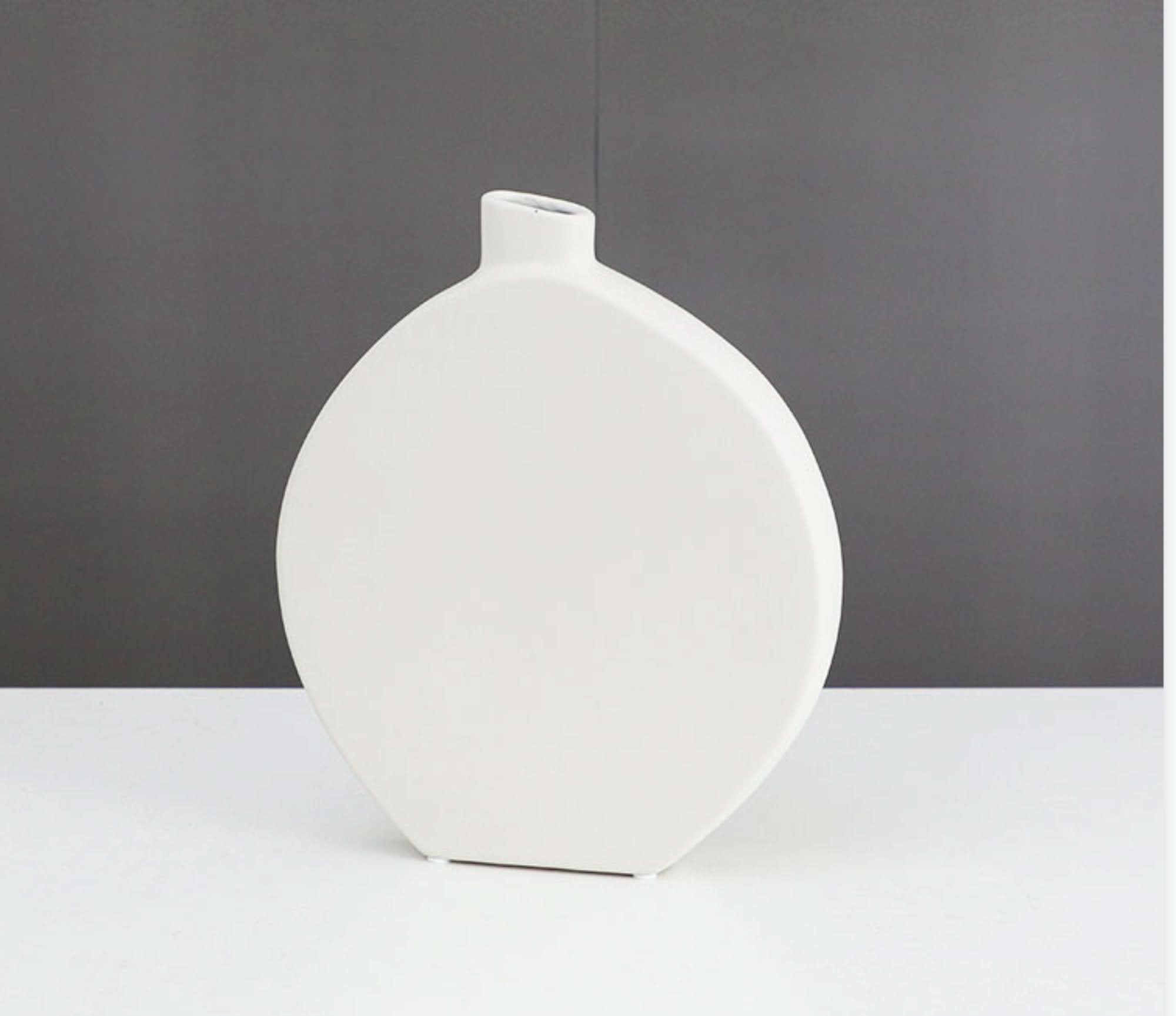 White minimalist ceramic table vase for zen decor.
