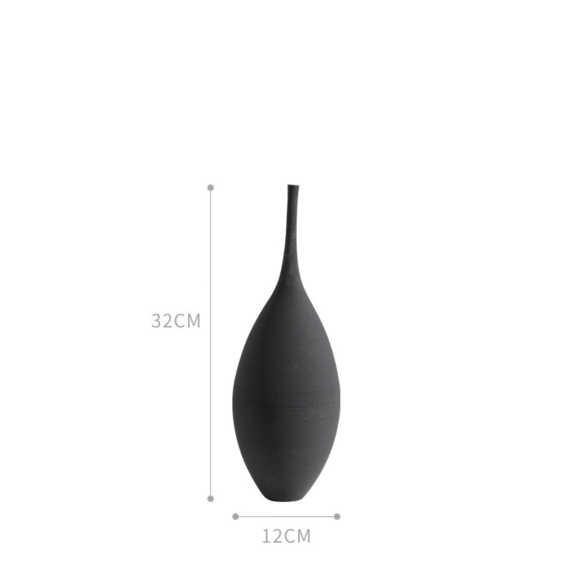 Black minimalist ceramic vase, 32cm tall, 12cm wide, on a white background.