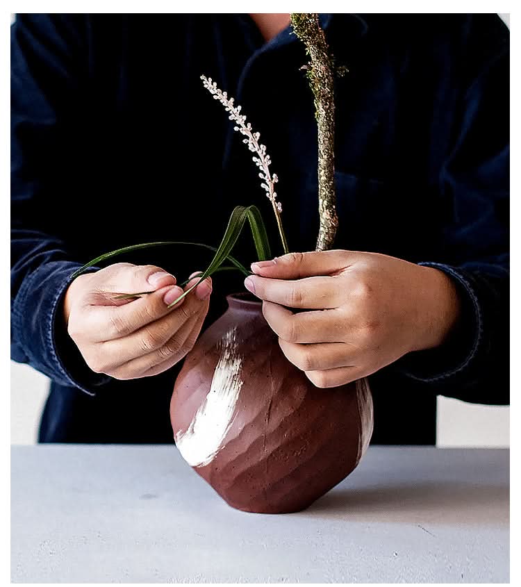 Brown vase with brushed stroke, a modern home decor piece.