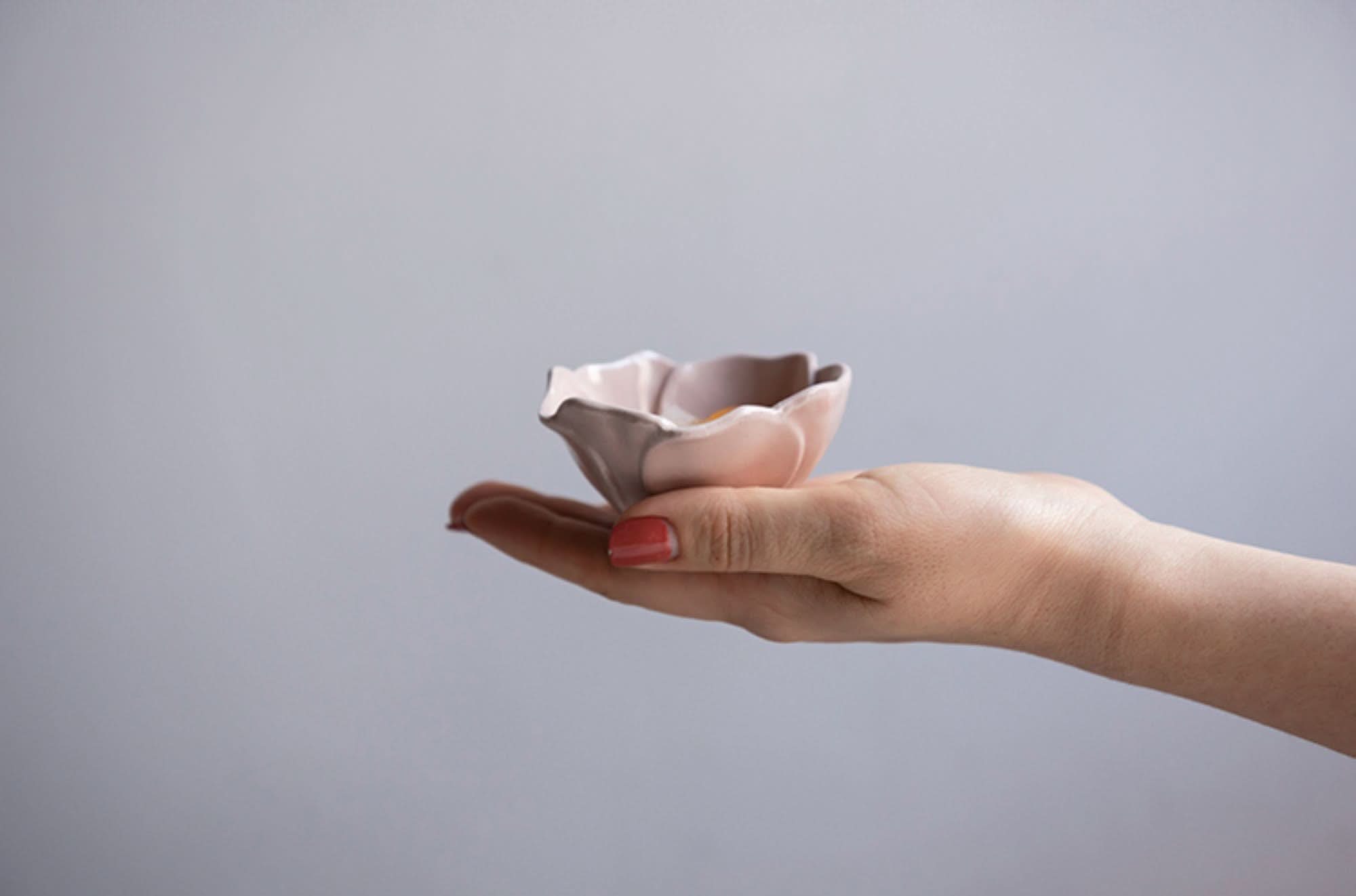 Handheld pink Camellia Ceramic Sauce Bowl, handmade stoneware ornament from Japan.