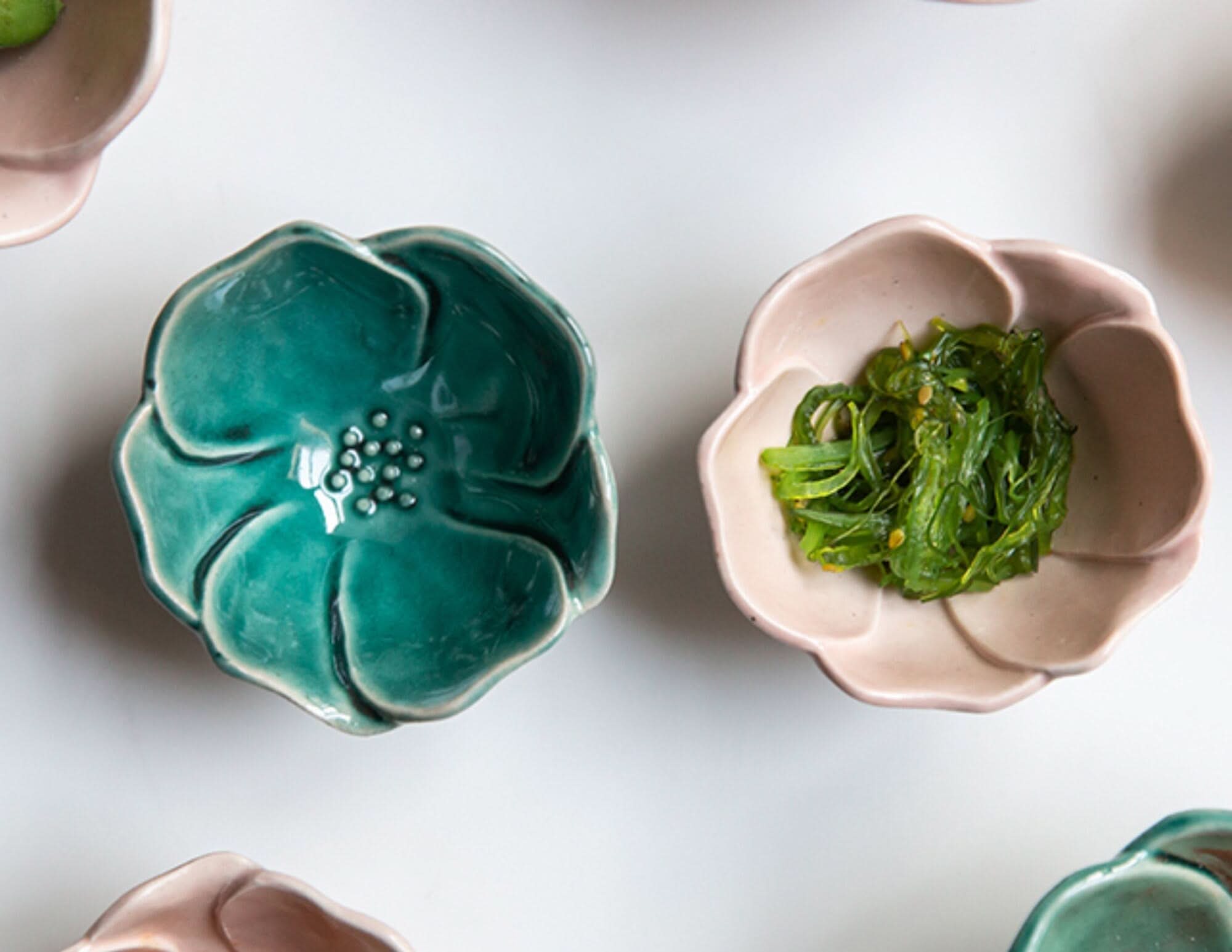 Camellia Ceramic Sauce Bowl in teal and pink, handmade stoneware dish with appetizer.