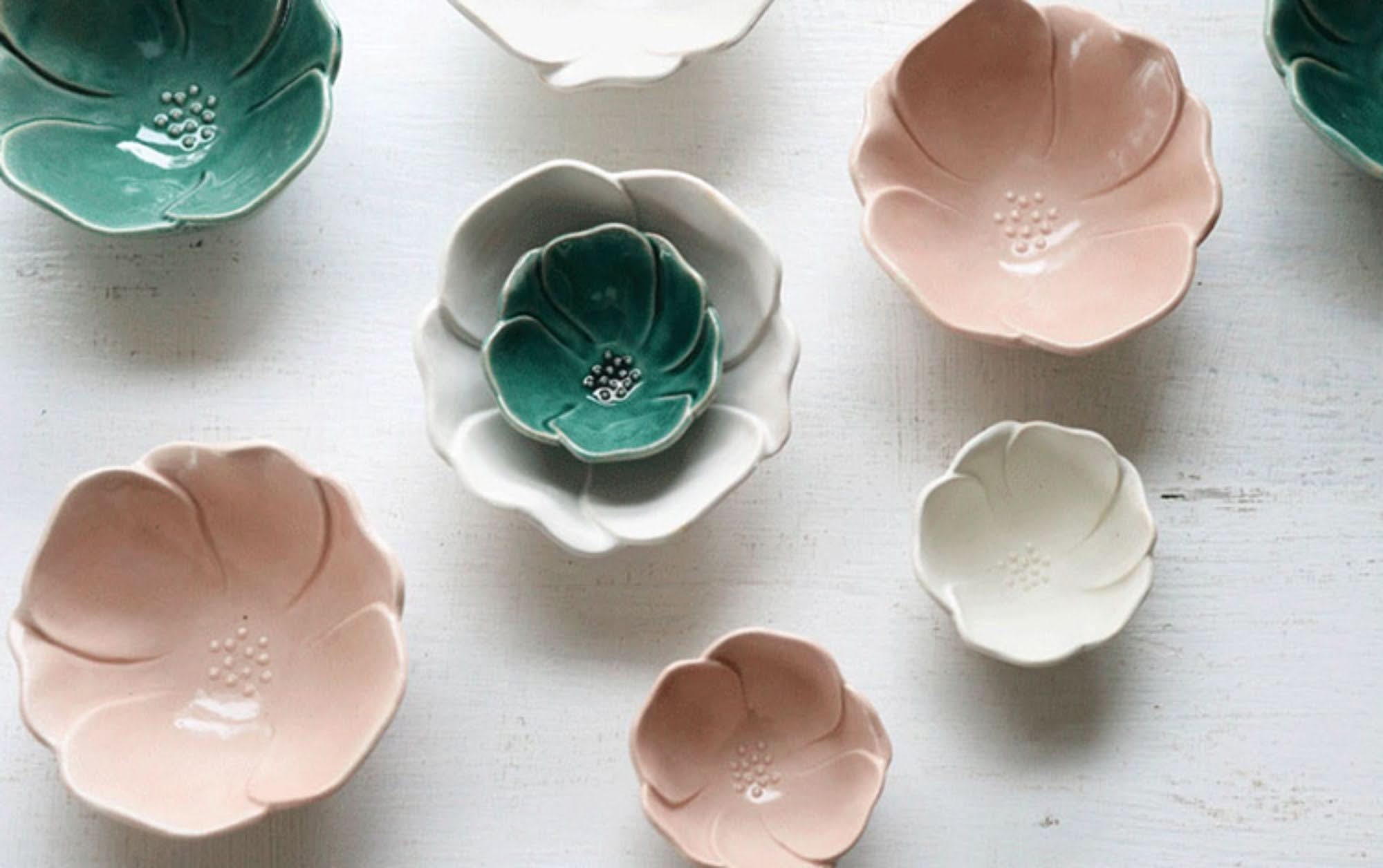 Handmade Camellia Ceramic Sauce Bowls in pastel pink, seafoam green, and white, shaped like flowers.