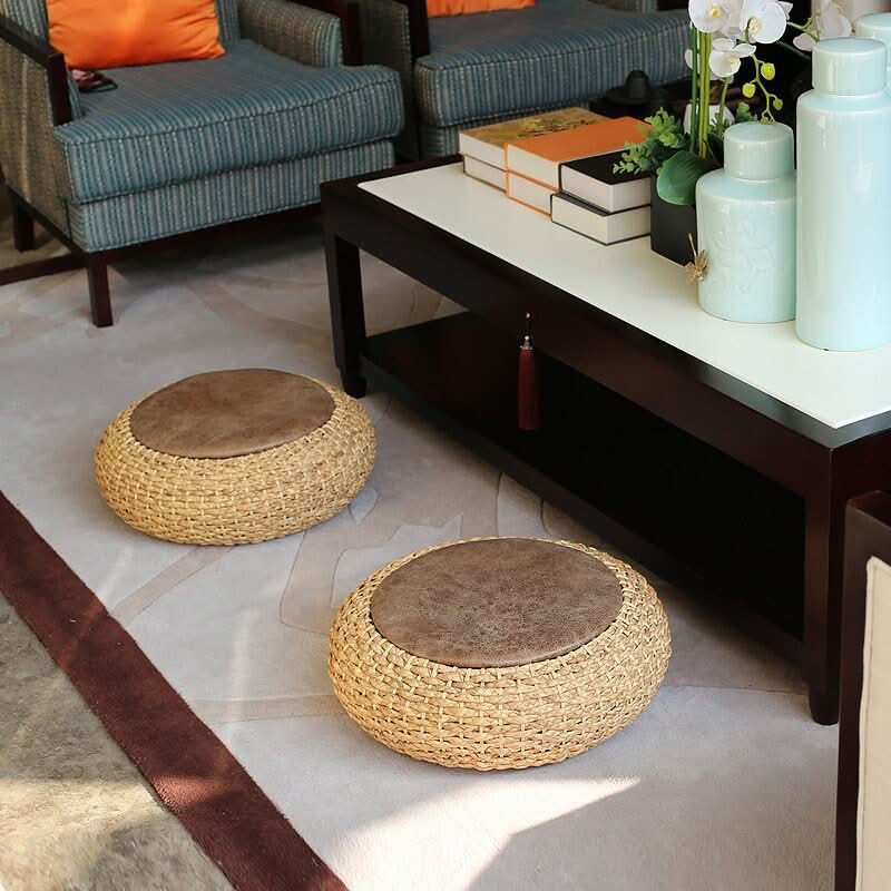 Cattail Woven Round Futon with brown cushion top, natural woven material.