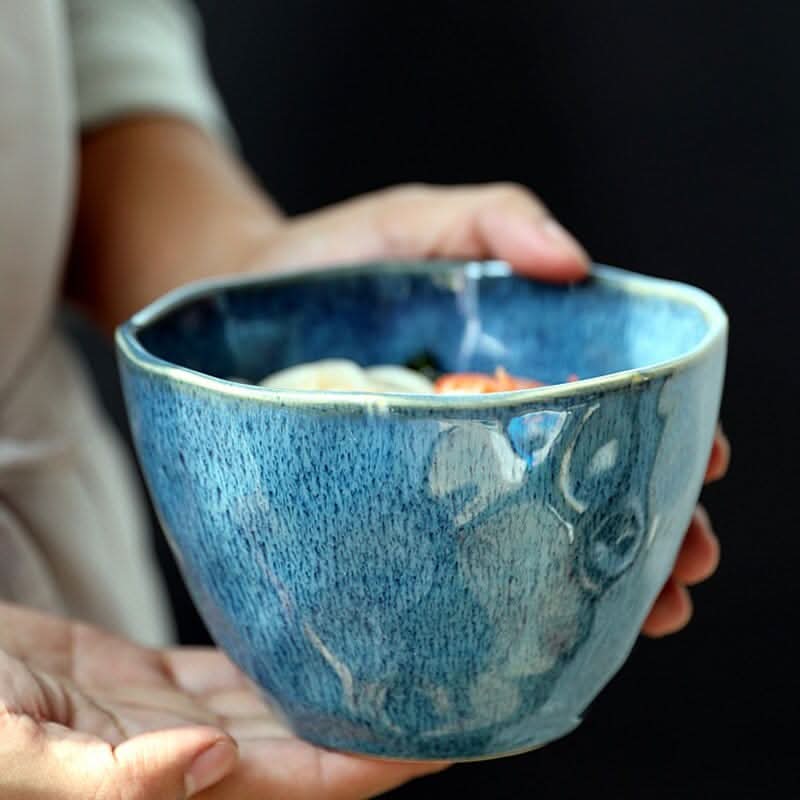 Ceramic Blue Glazed 5.9" Bowl filled with food, held by hands