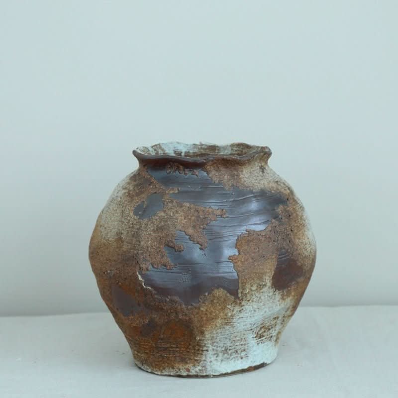 Ceramic Irregular Vase with rough, metallic texture in brown and blue hues. Handmade stoneware home decor.