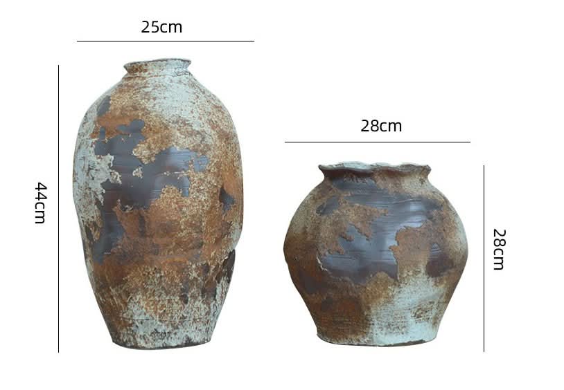 Two ceramic irregular vases with rough, metallic textures in earthy tones, perfect for home decor.
