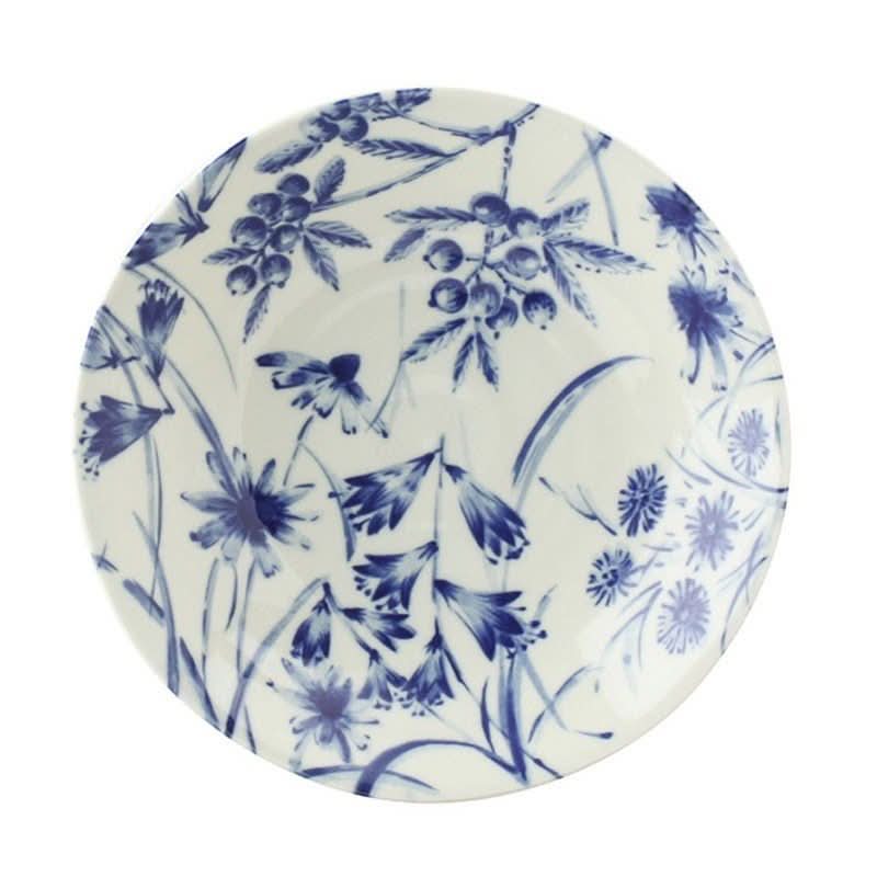 Ceramic Japanese hand-painted tableware with blue floral and berry pattern on white.