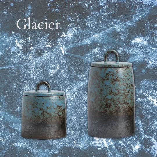 Glacier Ceramic Tea Canisters: two teal and grey textured canisters with lids, on icy background.