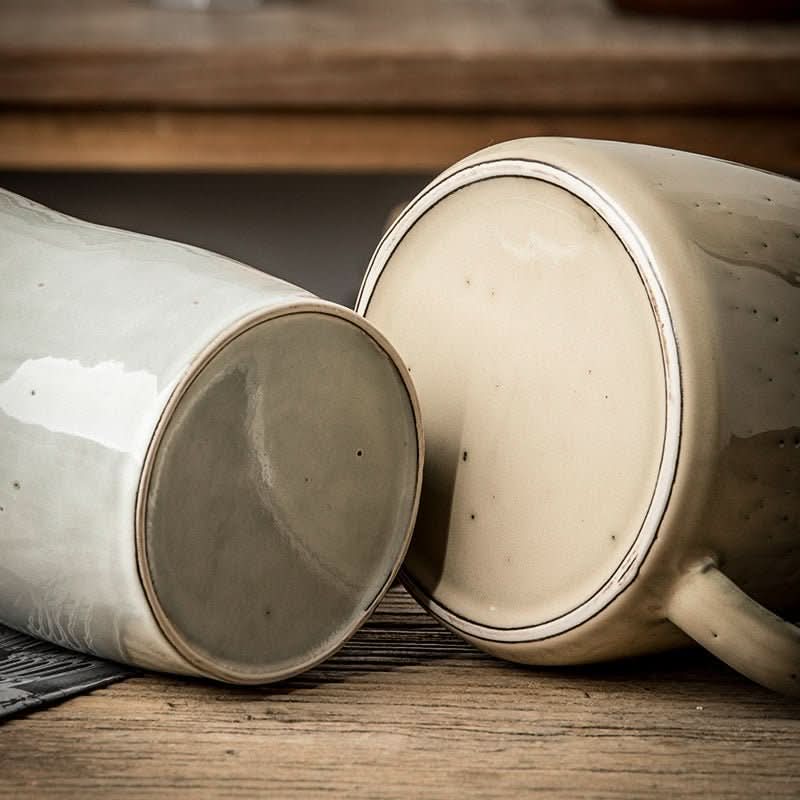 Ceramic pitcher utensil holder, light gray and beige, farmhouse style.