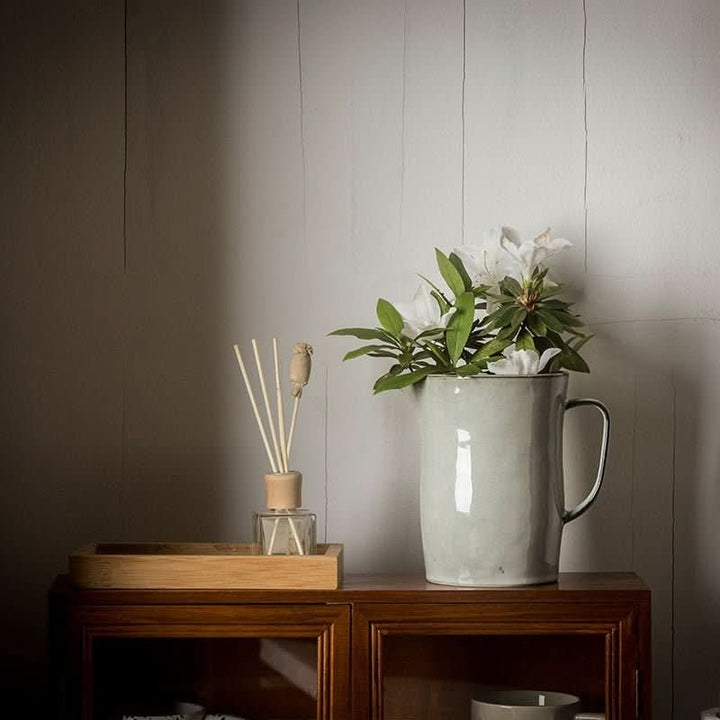 Light gray ceramic pitcher, farmhouse style utensil holder.