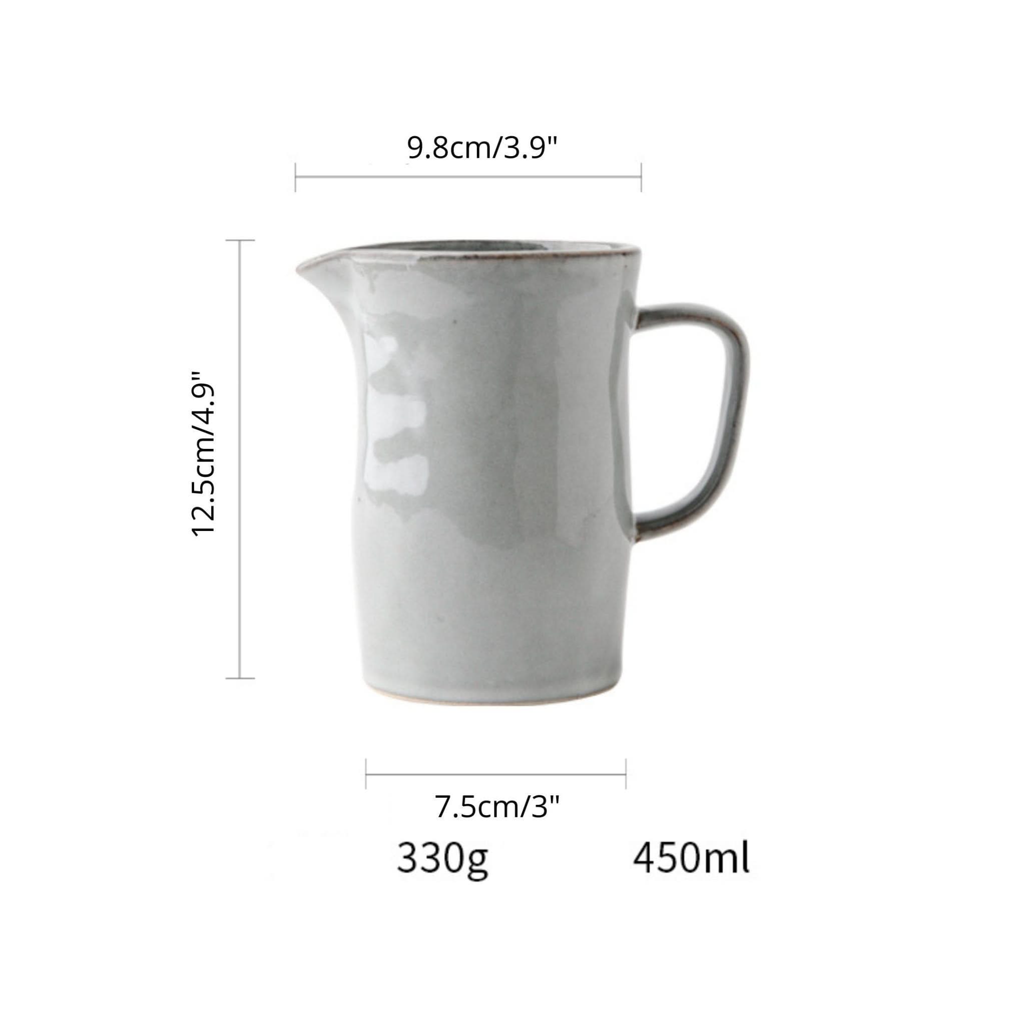 Gray ceramic pitcher utensil holder with farmhouse style, for kitchen fork and spoon storage.