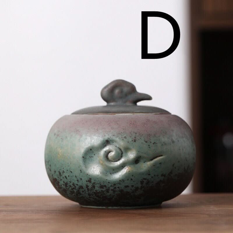 Ceramic tea can with Japanese cloud art illustration, green & purple glaze, kitchen storage jar.