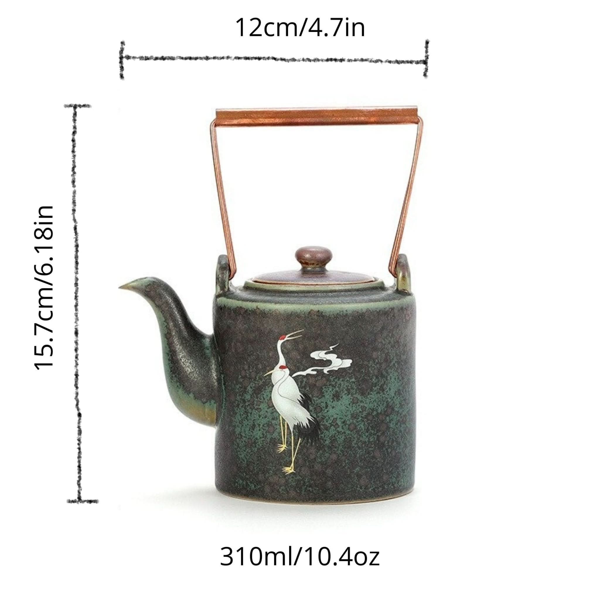 Ceramic tea pot with Japanese style crane design, dark green glaze, copper handle.
