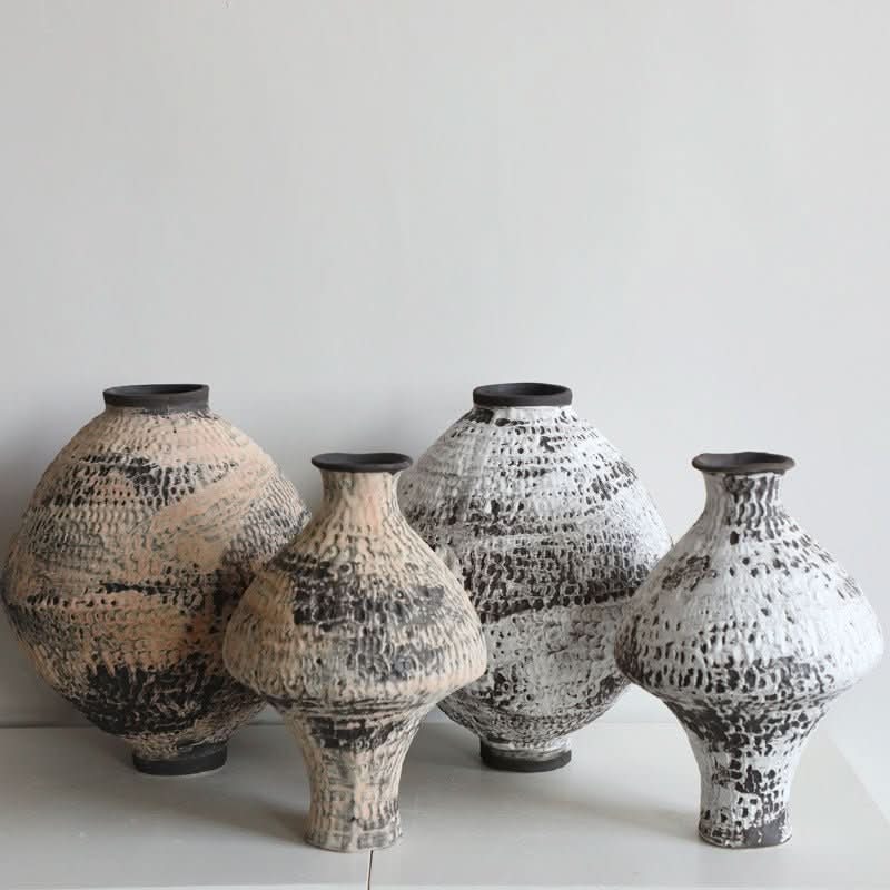 Ceramic vase with hammered texture and brushed effect, home decor piece, natural beige and black.