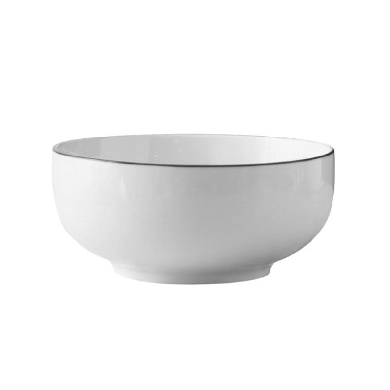 Ceramics white bowl made in Japan with black edges, clean white background.