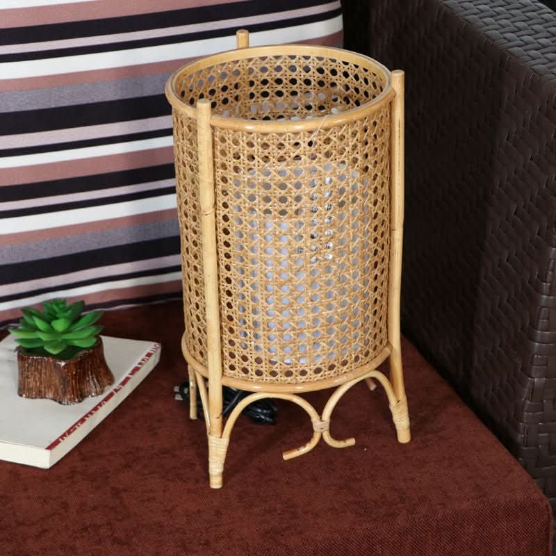 Handwoven natural rattan table lampshade with 3 legs, cylinder design, home decor accent.