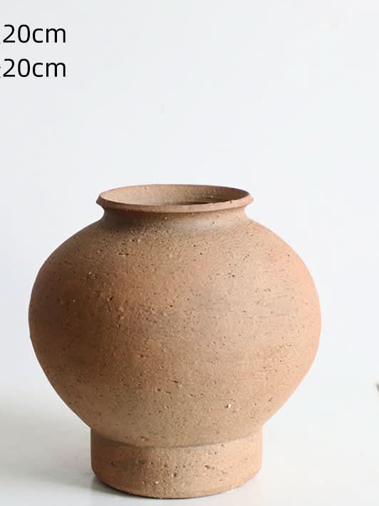 Cylindrical Curved Clay Brown Vase for home decor, earthy tones, textured pottery.