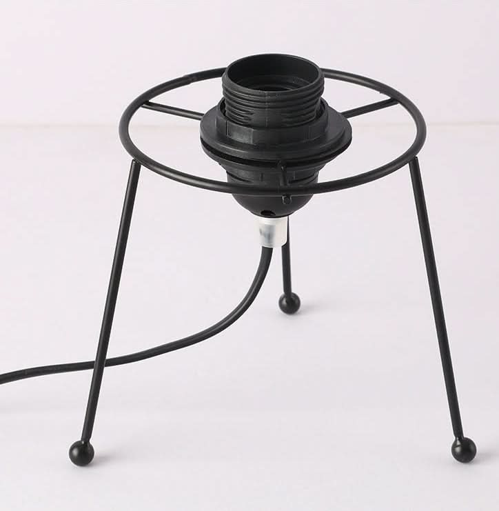 Black metal base for a rattan table lamp with cord.
